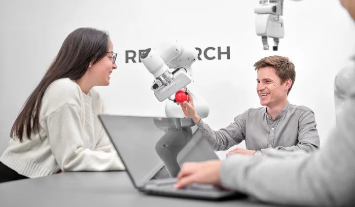 Franka Research 3 robot arm in a research workspace